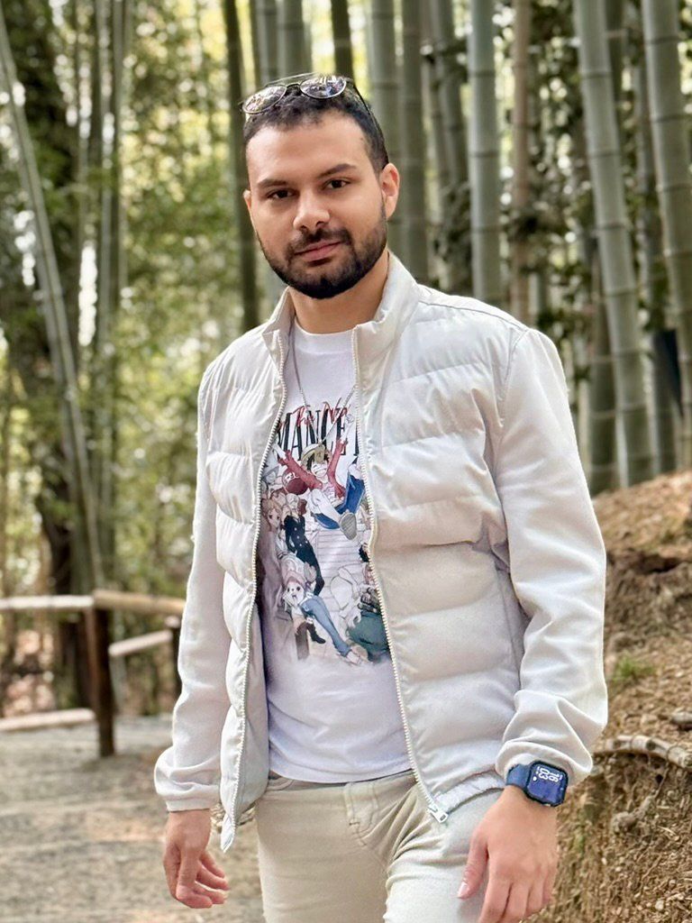 Adir walking through a towering bamboo grove