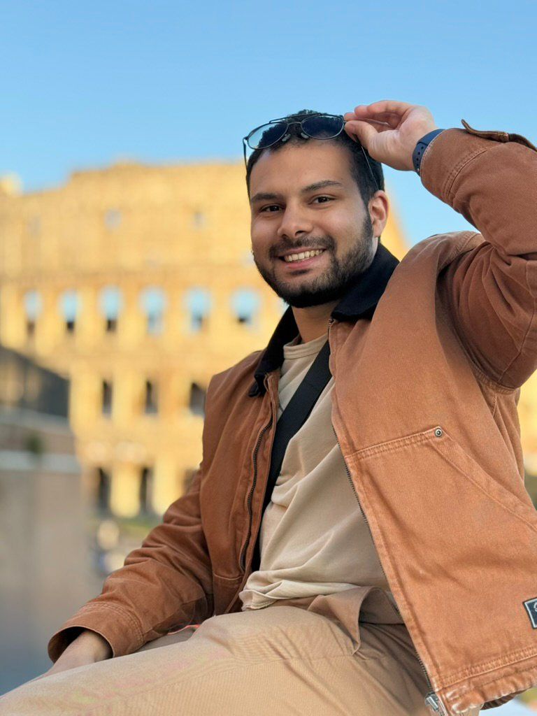 Adir in front of the Colosseum in Rome at golden hour